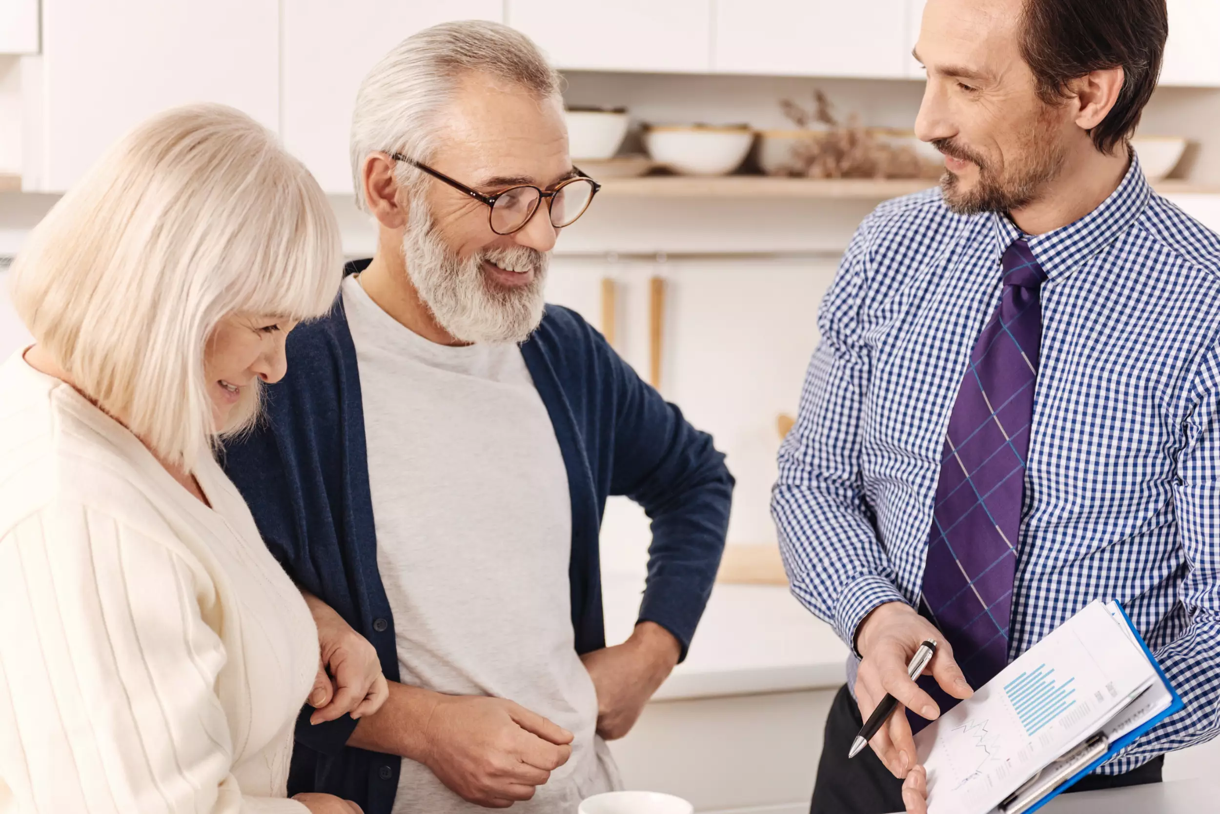 An older couple, talking with a title agent